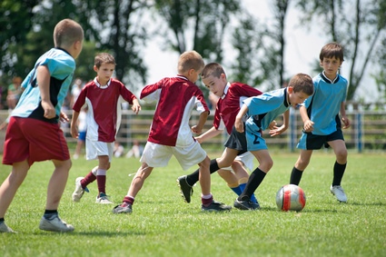 kids playing football outside